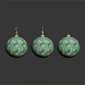 Three Turquoise Christmas Ornaments With Gold Leaf Patterns And Shiny Reflections
