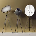 Modern Black Floor Lamps With Tripod Bases And Various Shade Designs On Beige Background
