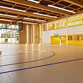 Spacious Basketball Gym Interior With Wooden Floor Hoops And Bright Lighting