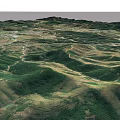 Aerial Planning of Mountainous Terrain With Rolling Hills Green Vegetation and Paths