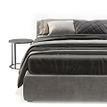 Modern Upholstered Double Bed With Layered Gray Beige Linens and Metal Frame Bedside Table
