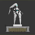 White Robot Character Standing On Black Base With Golden KORBOTRON Letters