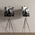 Art Supplies Easels Holding City Night Paintings With Figure Silhouettes On White Walls Wooden Floors