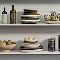 Organized Kitchenware On White Shelves With Jars Bowls Plates Vases And Fruits