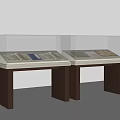 Glass Display Cases With Antique Documents On White Tops And Brown Stands
