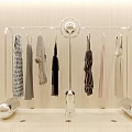 Modern Silver Metallic Clothes Rack with Hanging Dresses Coats and Apparel in Stylish