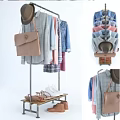 Metal Clothing Rack with Hanging Shirts Denim Jackets Sneakers Sandals and Handbags on Shelf