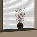 Dark Ceramic Vase with Small Flowers on Bright Windowsill Lit by Light Through White Blinds