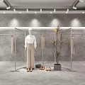 Modern Clothing Store Interior With Mannequins Clothing Racks And Decorative Plants