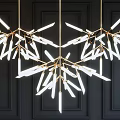 Modern Branch Like Chandelier With Golden Frame And White Light Tubes On Dark Wall