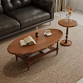 Wooden Oval Coffee Table with Open Book Coffee Cup and Side Table in Living Room