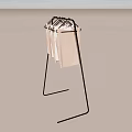 Black Metal Clothes Display Rack With Light Colored Tank Tops Hanging