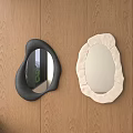 Two Decorative Mirrors Black Irregular And Cream Fabric Edge On Wooden Wall For Modern Interior