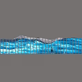 Blue Wave Shaped Glass Sculpture with Person Water Reflection and Mountain Sky
