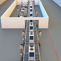 Workers Operating Industrial Equipment On Assembly Line With Conveyor Belt In Factory