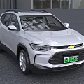 Silver Chevrolet SUV Featuring Green License Plate And Front Grille Design