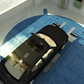 Black Car Parked On Blue Grid Pattern Floor In Indoor Area With Overhead Lighting