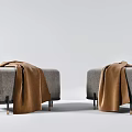 Modern Upholstered Sofa Stools With Gray Fabric And Brown Blanket On Black Metal Legs