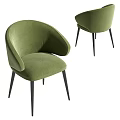 Green Velvet Dining Chairs With Curved Backrest And Black Metal Legs In Modern Design