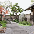 Japanese Style Garden Courtyard with Wooden Buildings Stone Lanterns Small Bridge Pebble Path and Pine Trees