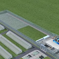 Industrial Factory Plant With Multiple Shed Structures Green Field And Security Fence