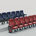 Modern Theater Seats Arranged In Blue And Red Rows With Armrests