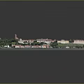 Aerial View of Charming Town With Red Rooftops Green Meadows and Waterfront Moored Boats