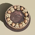Delicious Chocolate Cake Decorated with Cream Swirls and Chocolate Balls on Striped Base
