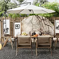 Outdoor Table With White Umbrella Bamboo Fence Decorative Paintings And Tea Set