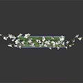 Clear Rectangular Vase With White Flowers And Green Leaves On Dark Reflective Surface
