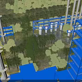 Lush Tropical Wetland Landscape With Dense Palm Trees Surrounding Modern Blue Industrial Plant Facilities