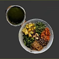 Colorful Fresh Food Bowl with Mango Carrots Green Vegetables Beans Sprouts and Green Sauce