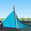 Modern Blue Geometric Building with Glass Facade and Trees Near Road