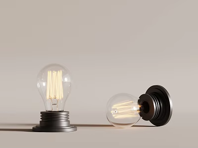 Vintage Light Bulbs Featuring Visible Filaments And Black Bases Two One Upright One Tilted 3d model