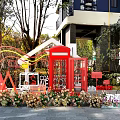 Red Telephone Booth And Rainbow Decoration With Balloons Flowers And Welcome Home Sign