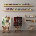 Art Supplies Display With Easels Paintings Paint Cans Palettes And Brushes On Shelves Table