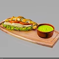 Fresh Croissant Sandwich With Lettuce Tomato Cheese And Green Sauce On Wooden Tray
