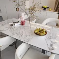 Modern Dining Table Set with Marble Top White Chairs Vase Branches Fruit Bowl and Pears