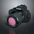 Fujifilm Black Camera Body With Pink Filter Lens On Reflective Surface