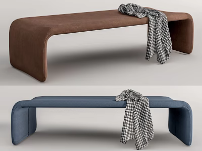 Brown And Blue Upholstered Ottoman With Black And White Checkered Blanket 3d model