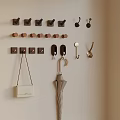 Entryway Wall With Various Style Hooks Hanging White Handbag And Umbrella