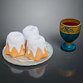 Delicious White Frosting Topped Pastries on Silver Plate and Blue Gold Cup with Red Drink