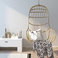 Stylish Rattan Hanging Chair With Decorative Pillow And Blanket By White Side Table