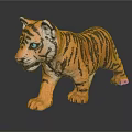 Tiger Cub Toy With Orange Black Stripes And Blue Eyes Standing On Reflective Surface