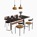 Stylish Dining Table Set With Black Top Brown Black Chairs And Yellow Pendant Lights
