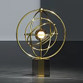 Modern Gold Metal Decorative Ornament Set With Circular Frame And Glowing Sphere On Marble Base