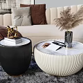 Beige Curved Sofa with Pillows Throw Blanket Round White Coffee Table and Black Table on Gray Rug