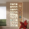 Modern Stylish Figure Cabinet Interior Design With Circular Display Holes Collectible Figures And Red Chair