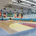 Modern Indoor Basketball Gym With Blue Seats Lights And Screens