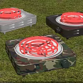 Electric Hot Plates In White Black And Camouflage On Green Grass